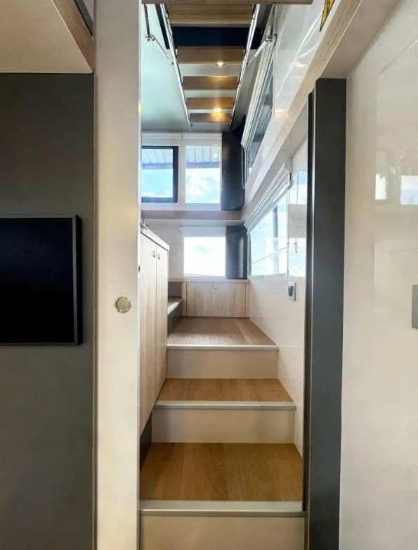 Slide: The Image of Modern interior staircase in Navisyo Homes NV.08, 2022 model, featuring wood and sleek design. - 7