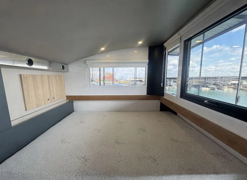 Slide: The Image of Modern Navisyo Homes NV.08 interior, spacious room with large windows and wooden accents, 2022 model. - 9