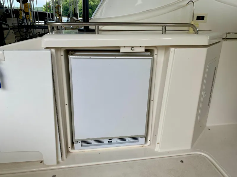 Slide: The Image of 2007 Cruisers Yachts 370 Express interior with built-in refrigerator. - 11