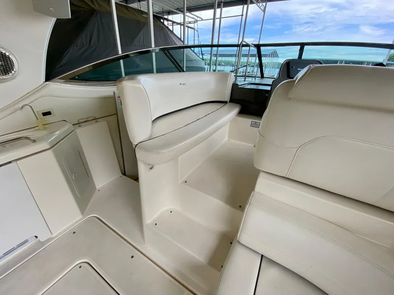 Slide: The Image of 2007 Cruisers Yachts 370 Express interior with white seating and sleek design. - 14