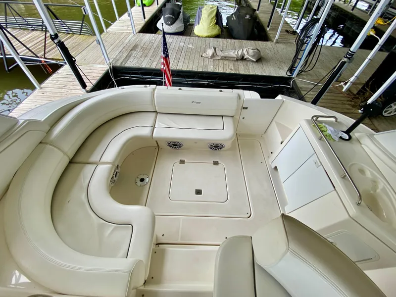 Slide: The Image of 2007 Cruisers Yachts 370 Express interior with seating and dock view. - 16