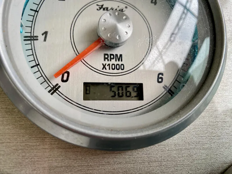 Slide: The Image of Close-up of a Faria RPM gauge showing 506.9 hours on a 2007 Cruisers Yachts 370 Express. - 25