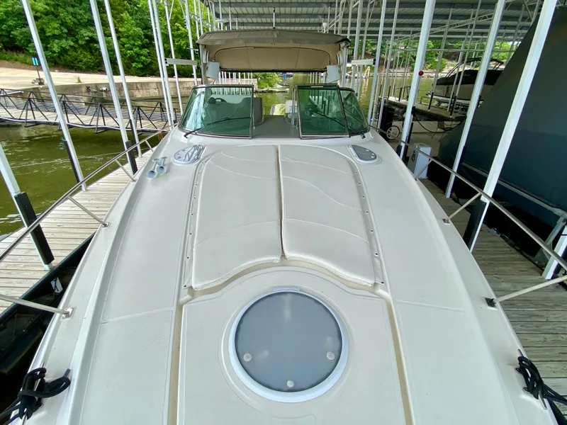 Slide: The Image of 2007 Cruisers Yachts 370 Express docked, showcasing spacious deck and sleek design. - 28