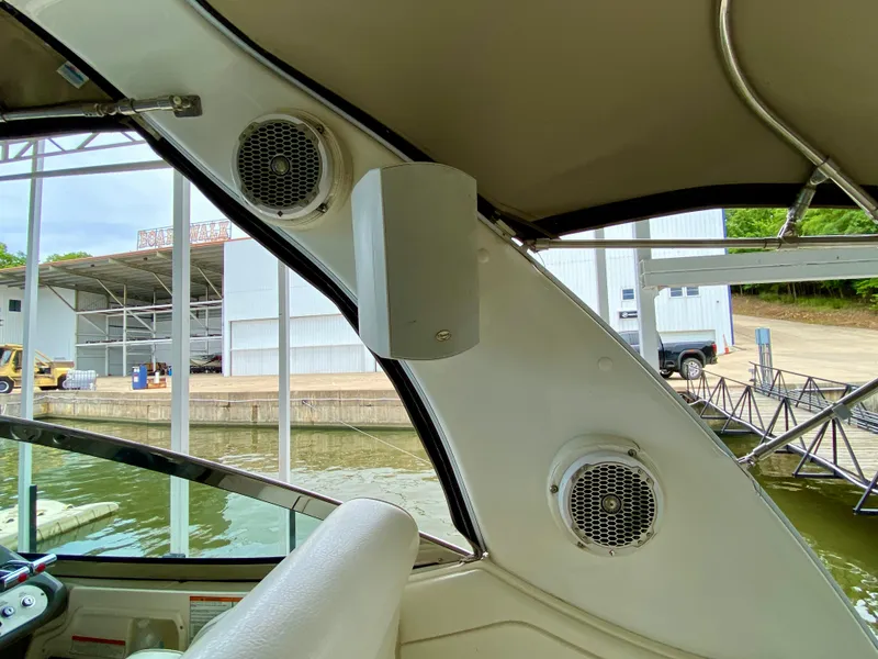 Slide: The Image of 2007 Cruisers Yachts 370 Express interior with speakers and marina view. - 29