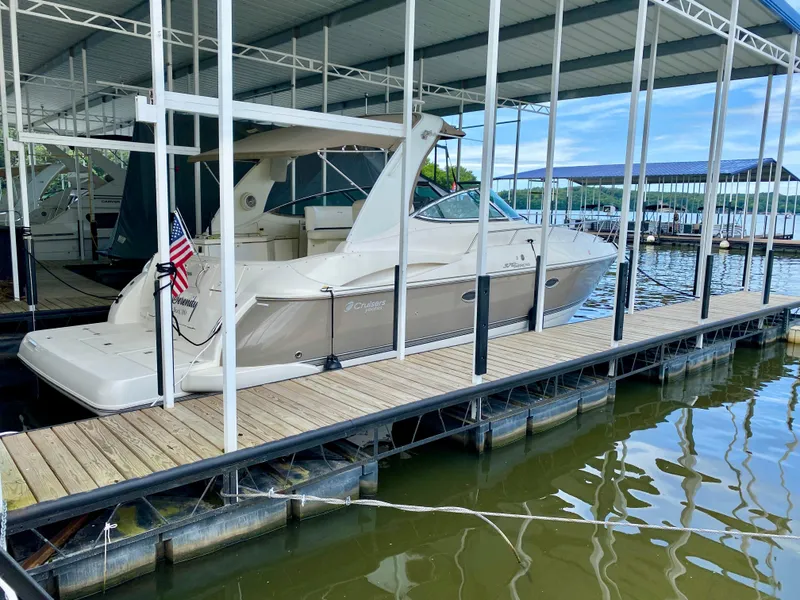 Slide: The Image of 2007 Cruisers Yachts 370 Express docked under covered marina. - 3