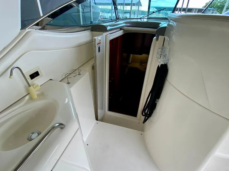 Slide: The Image of 2007 Cruisers Yachts 370 Express interior with sink and cabin entrance. - 31