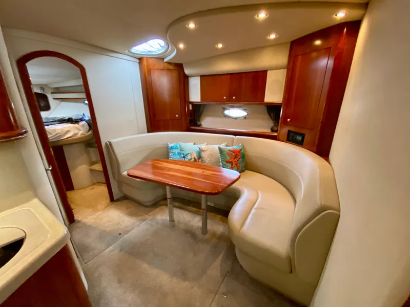 Slide: The Image of Luxurious 2007 Cruisers Yachts 370 Express interior with cozy seating and elegant wood finishes. - 33