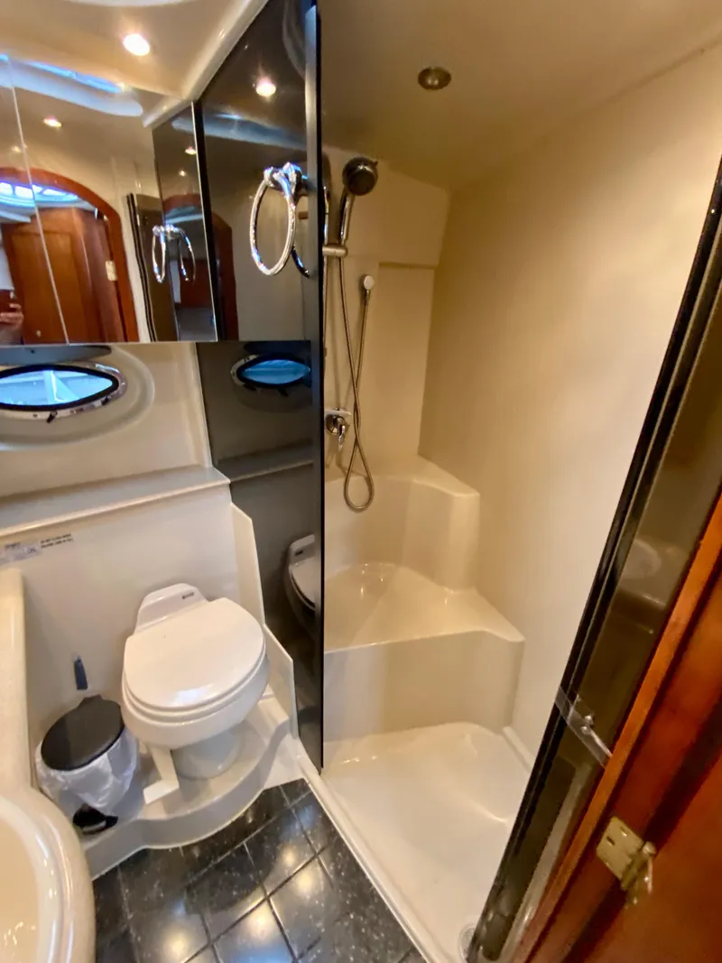 Slide: The Image of Luxurious bathroom in 2007 Cruisers Yachts 370 Express, featuring shower and toilet. - 43