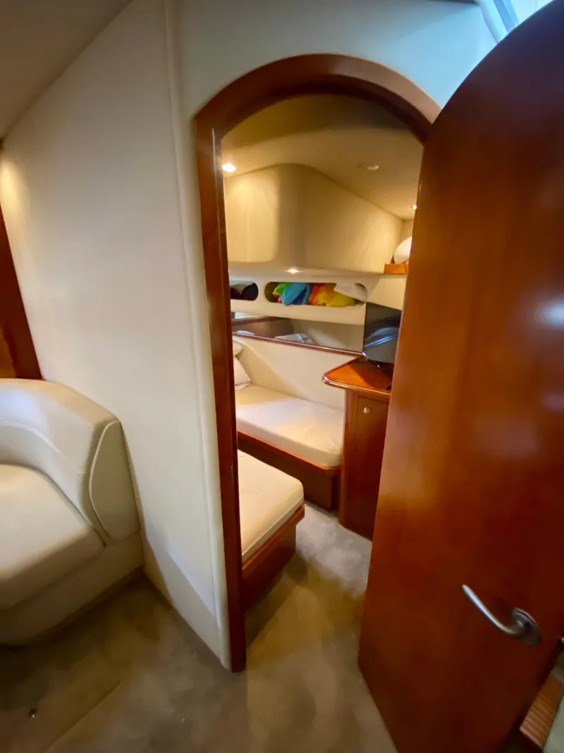 Slide: The Image of Interior cabin of 2007 Cruisers Yachts 370 Express, featuring cozy seating and wooden finishes. - 46