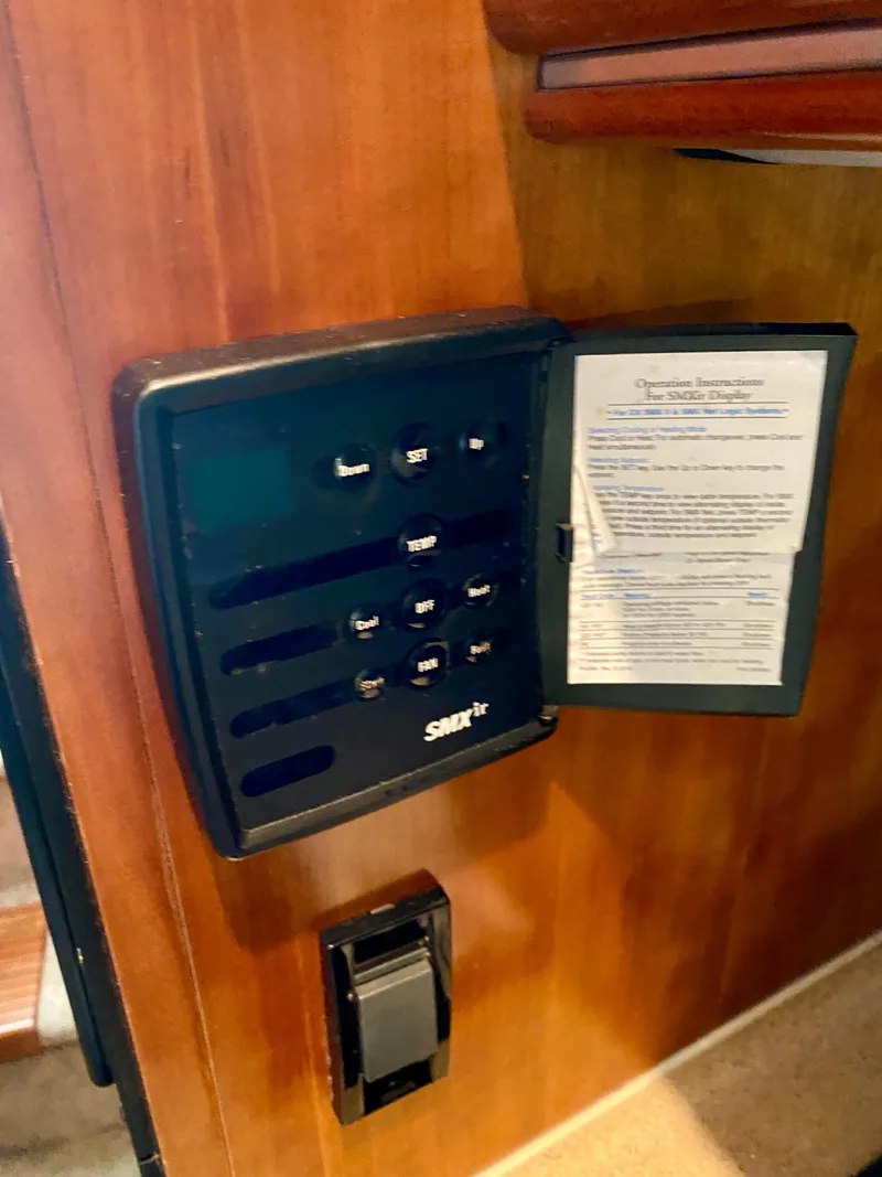 Slide: The Image of Control panel on 2007 Cruisers Yachts 370 Express, featuring SMXir system and operation instructions. - 48