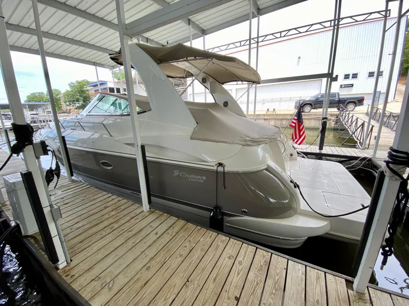 Slide: The Image of 2007 Cruisers Yachts 370 Express docked under covered marina. - 5