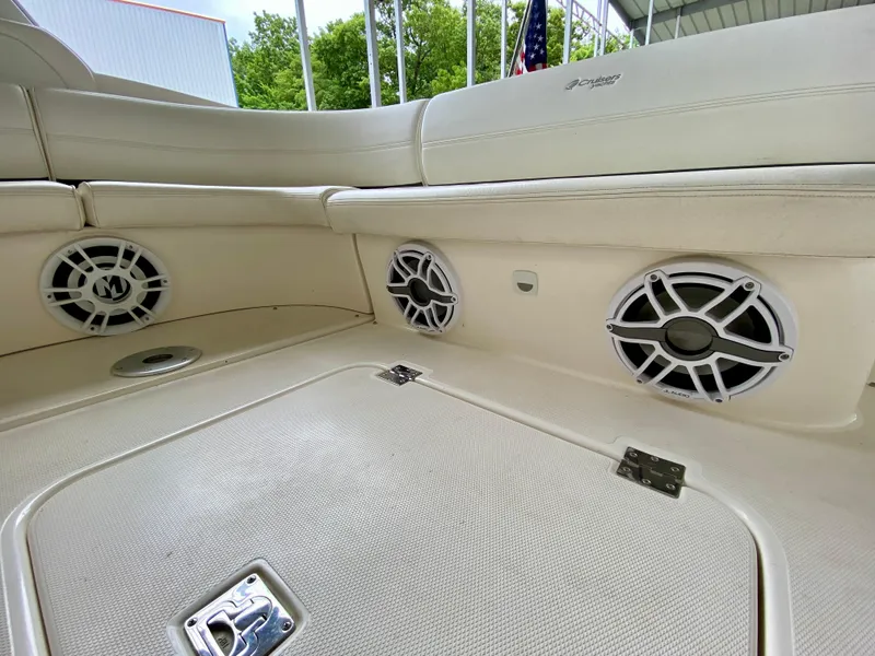Slide: The Image of 2007 Cruisers Yachts 370 Express interior with speakers and seating. - 9
