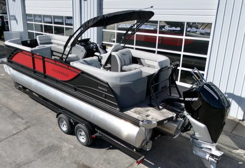 Slide: The Image of 2025 Godfrey Monaco 255 SB iMPACT pontoon boat with Mercury engine on trailer. - 15