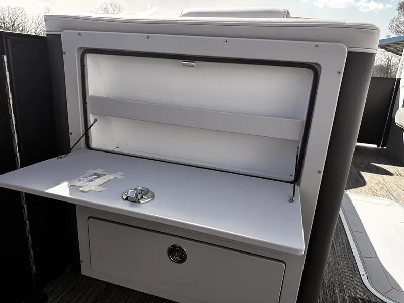 Slide: The Image of Open storage compartment on 2025 Godfrey Monaco 255 SB iMPACT pontoon boat. - 18