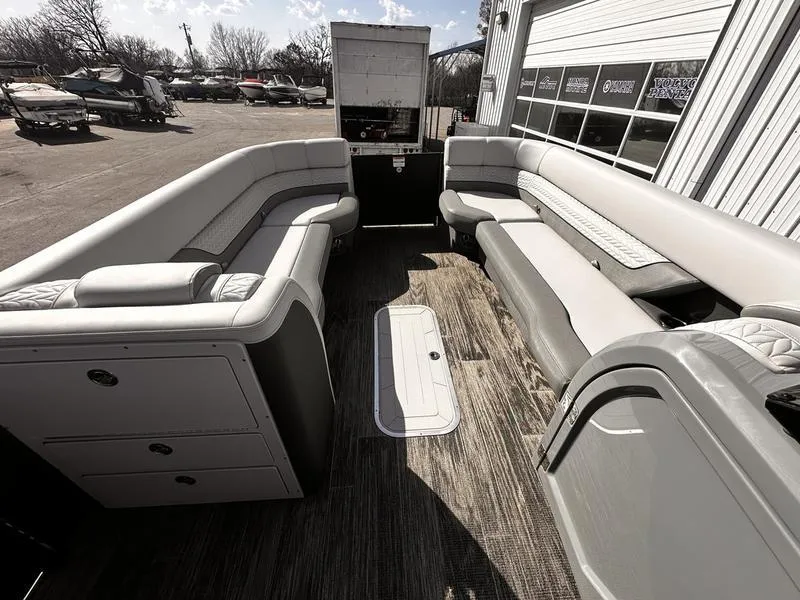 Slide: The Image of 2025 Godfrey Monaco 255 SB iMPACT pontoon boat interior with spacious seating and modern design. - 20