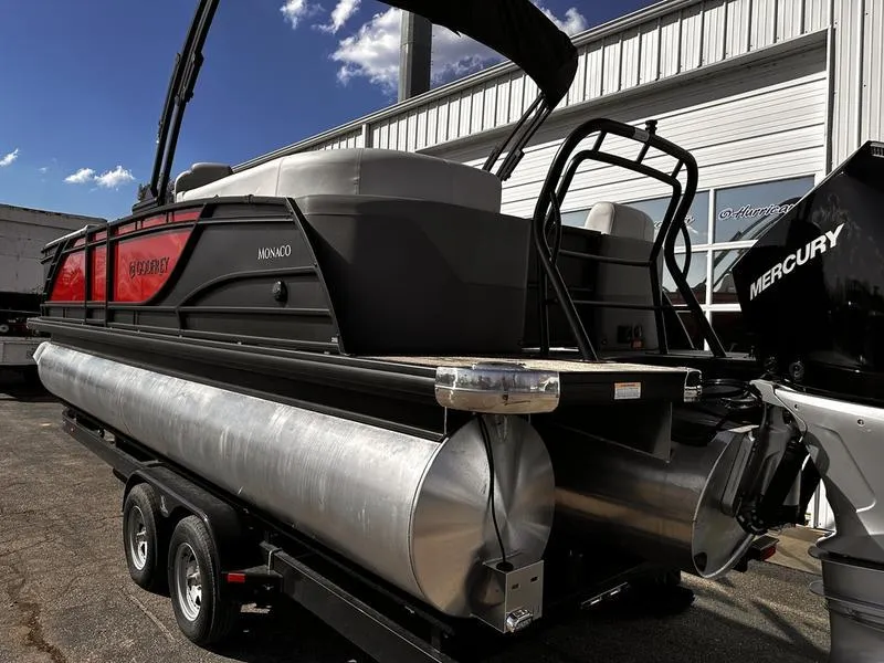 Slide: The Image of 2025 Godfrey Monaco 255 SB iMPACT pontoon boat on trailer, featuring Mercury engine. - 22