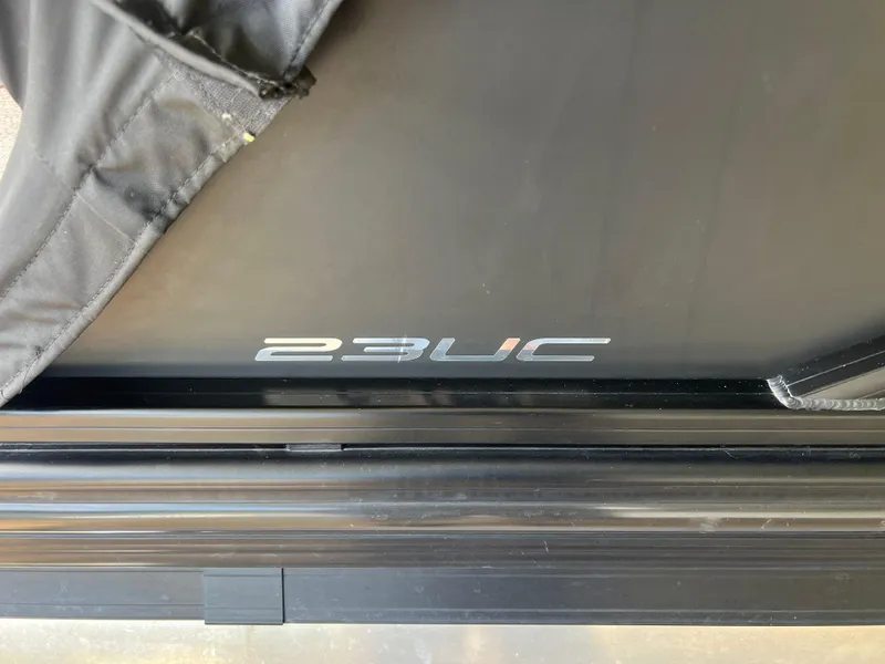 Slide: The Image of 2024 Barletta Lusso 23UC boat detail with cover partially removed. - 12