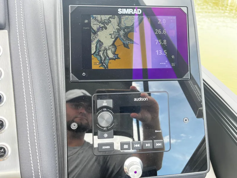 Slide: The Image of Control panel of 2024 Barletta Lusso 23UC with Simrad display and Audison audio system. - 14