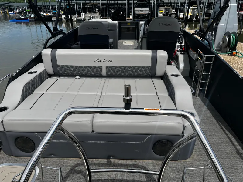 Slide: The Image of 2024 Barletta Lusso 23UC pontoon boat interior with luxurious seating and modern design. - 18