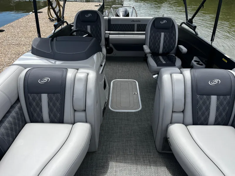 Slide: The Image of 2024 Barletta Lusso 23UC pontoon boat interior with luxurious seating and elegant design. - 23