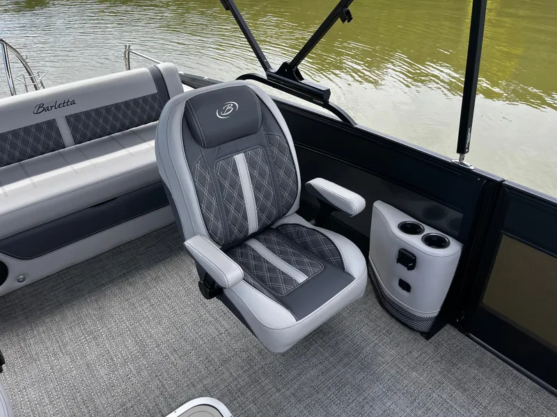 Slide: The Image of 2024 Barletta Lusso 23UC boat interior with luxurious seating and cup holders. - 25