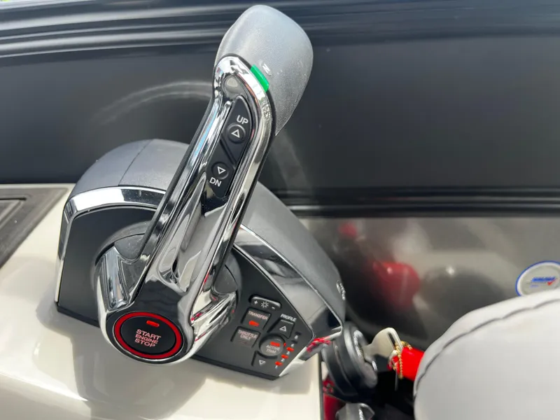 Slide: The Image of 2024 Barletta Lusso 23UC throttle control with start/stop button and trim adjustments. - 27