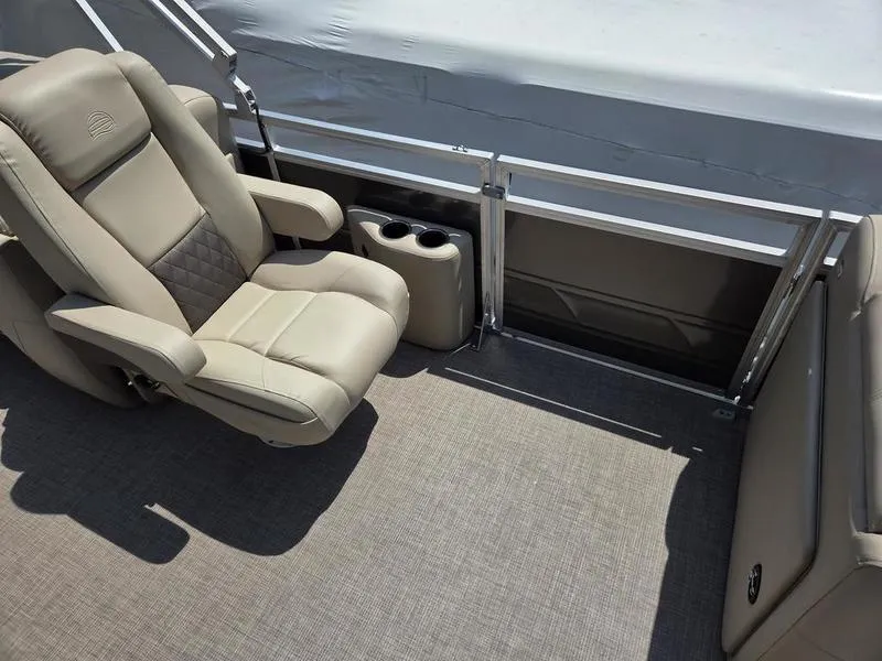 Slide: The Image of Luxurious seating on 2025 Sun Tracker PARTY BARGE® 22 DLX pontoon boat with cup holders. - 15