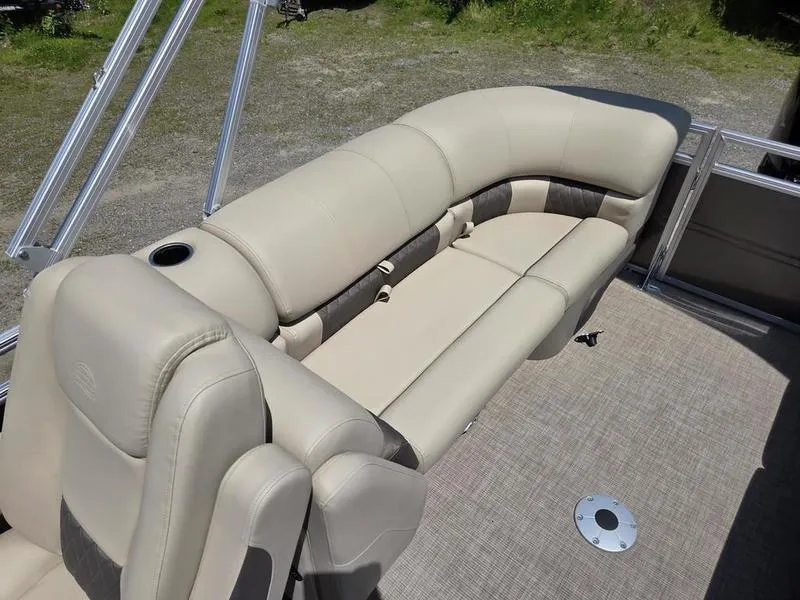 Slide: The Image of 2025 Sun Tracker PARTY BARGE® 22 DLX with beige seating and spacious deck. - 17