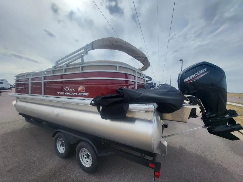 Slide: The Image of 2025 Sun Tracker Party Barge 20 DLX pontoon boat with Mercury outboard motor. - 2