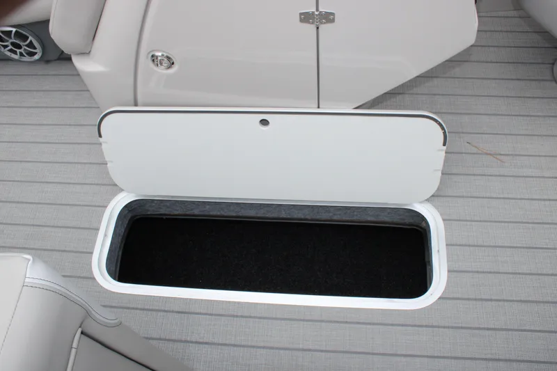 Slide: The Image of Open storage compartment on 2025 Starcraft SLS 3 boat deck. - 11