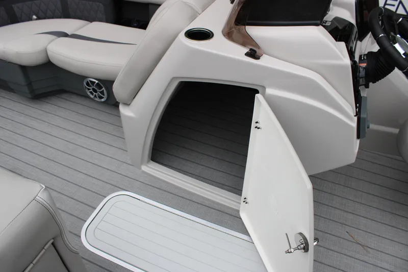 Slide: The Image of 2025 Starcraft SLS 3 boat interior with open storage compartment and seating area. - 12