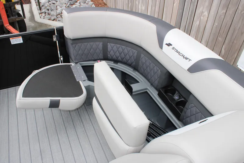 Slide: The Image of Luxurious seating on 2025 Starcraft SLS 3 boat, featuring quilted upholstery and cup holders. - 14