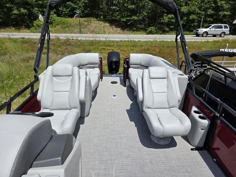 Slide: The Image of 2025 Regency 230 DL3 pontoon boat with spacious seating and modern design. - 10