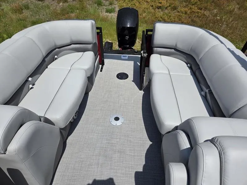 Slide: The Image of 2025 Regency 230 DL3 pontoon boat with spacious seating and modern design. - 13