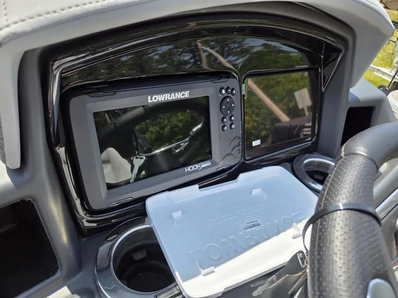 Slide: The Image of Dashboard of 2025 Regency 230 DL3 with Lowrance Hook Reveal fish finder. - 15