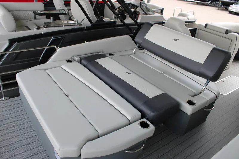 Slide: The Image of 2025 Starcraft EXS 3 DL boat interior with gray seating and cup holders. - 18