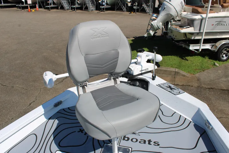 Slide: The Image of Gray captain's chair on 2026 Xpress H22B Bay boat deck, featuring Minn Kota trolling motor. - 10