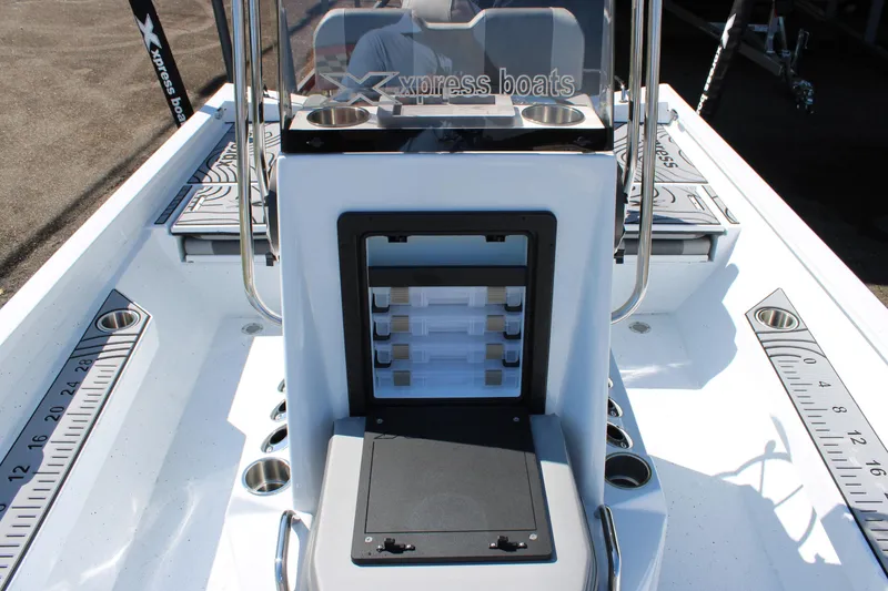 Slide: The Image of 2026 Xpress H22B Bay boat interior with storage compartments and measuring guides. - 12