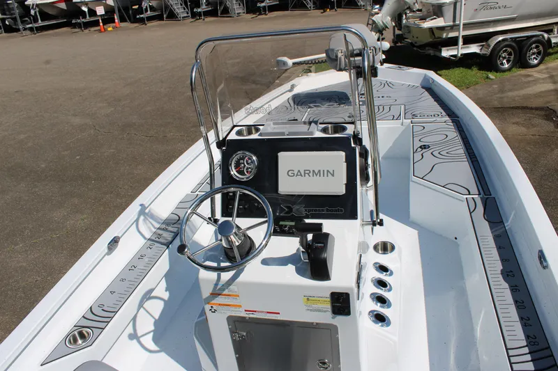 Slide: The Image of 2026 Xpress H22B Bay boat interior with Garmin navigation system and sleek design. - 5