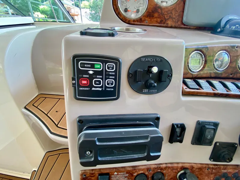 Slide: The Image of Control panel of a 2006 Rinker 360 Fiesta Vee boat with gauges and switches. - 18