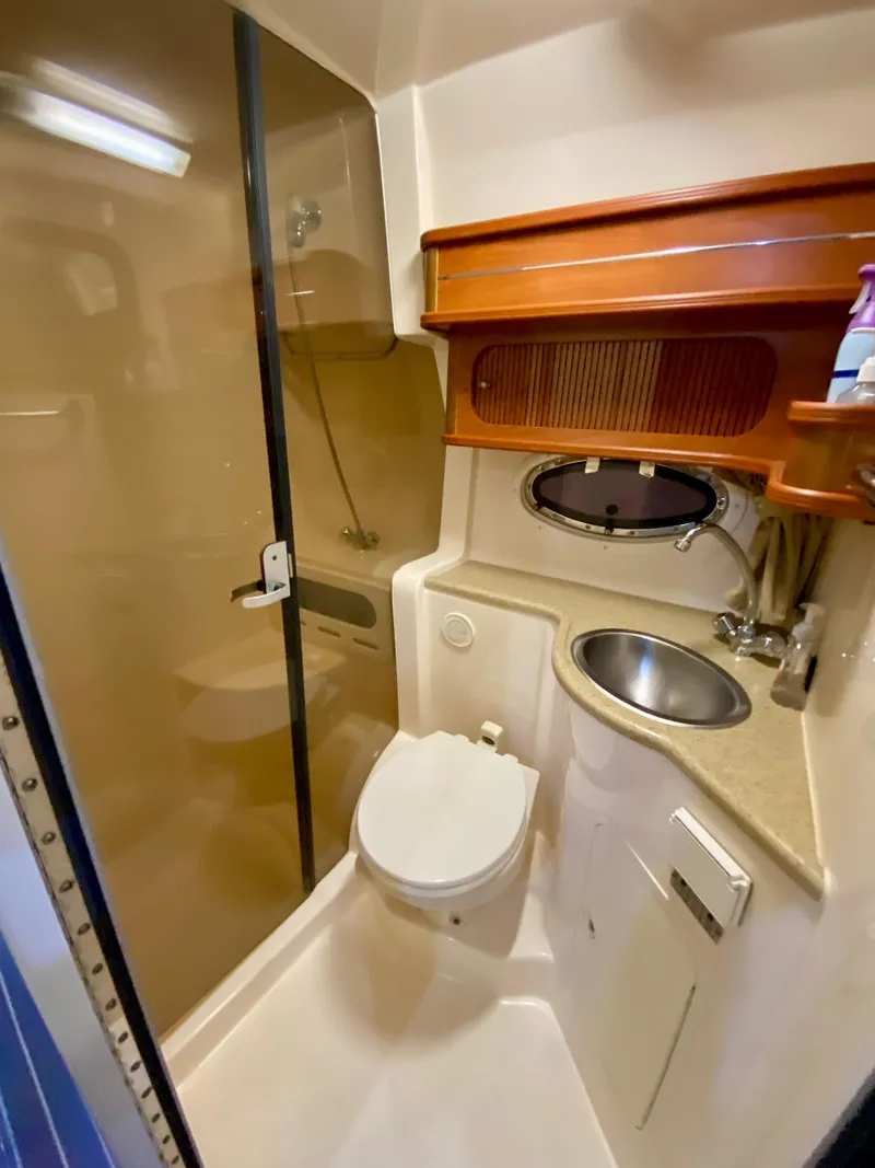 Slide: The Image of 2006 Rinker 360 Fiesta Vee bathroom with shower, sink, and toilet. - 35