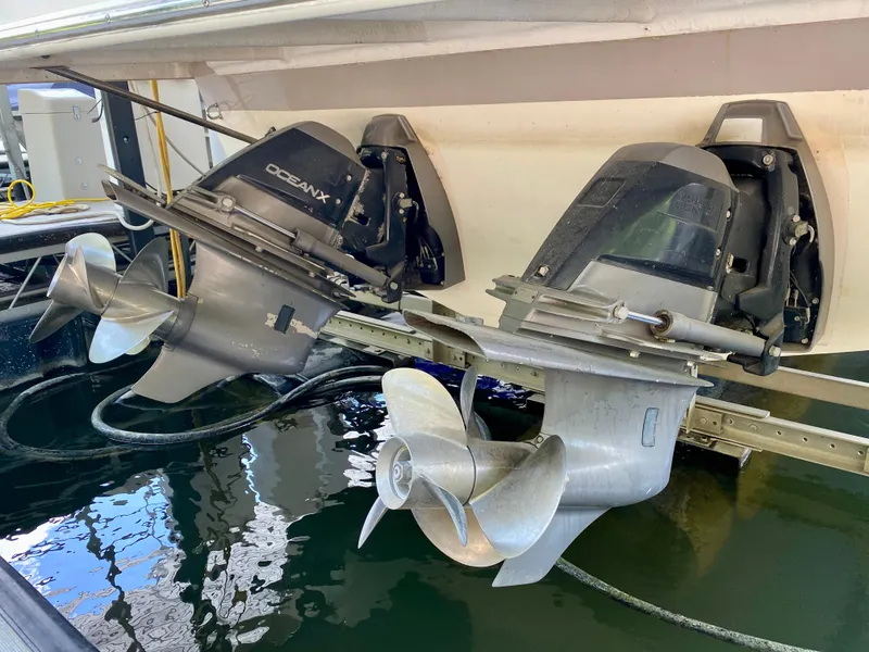 Slide: The Image of 2006 Rinker 360 Fiesta Vee boat with OceanX outdrives in a marina setting. - 37