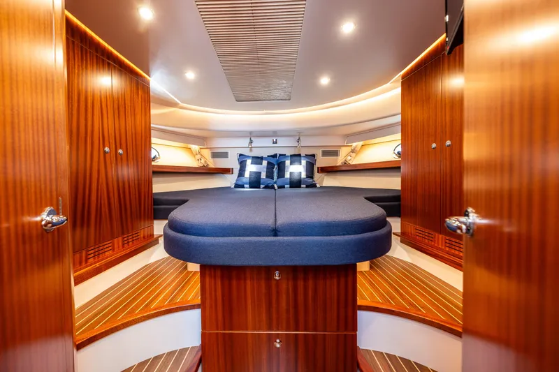 Slide: The Image of Luxurious interior of 2021 Nimbus 405 Coupé yacht with elegant wood finish and cozy bedding. - 34
