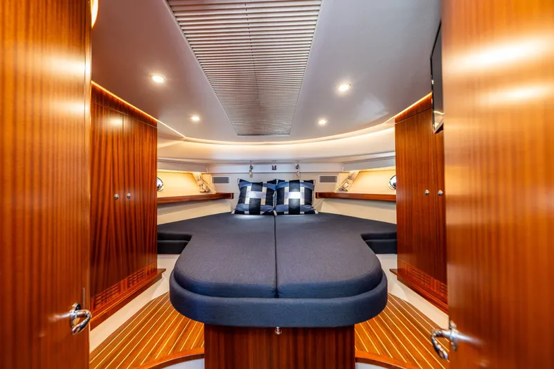Slide: The Image of Luxurious cabin interior of 2021 Nimbus 405 Coupé yacht with elegant wood finish. - 35