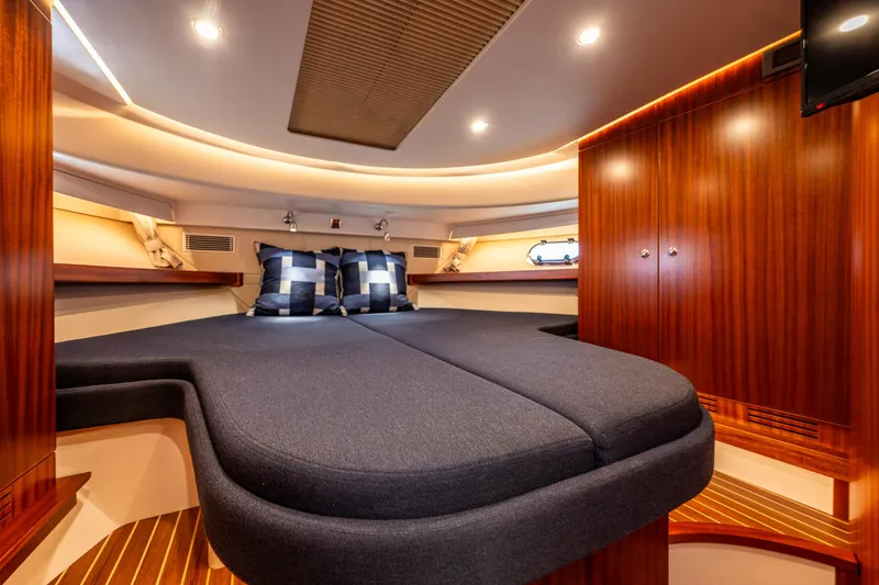 Slide: The Image of Luxurious cabin interior of 2021 Nimbus 405 Coupé yacht with elegant wood finish. - 36