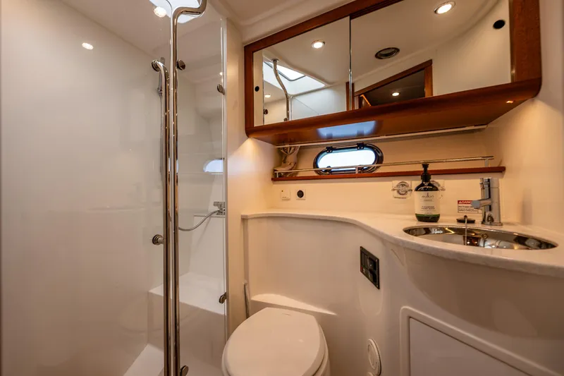 Slide: The Image of Luxurious bathroom in 2021 Nimbus 405 Coupé yacht, featuring modern fixtures and elegant design. - 38