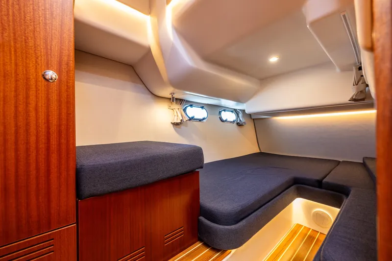 Slide: The Image of Luxurious interior cabin of 2021 Nimbus 405 Coupé yacht with wooden accents and cozy seating. - 40