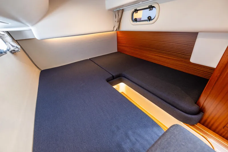 Slide: The Image of Interior cabin of 2021 Nimbus 405 Coupé, featuring cozy bedding and wooden accents. - 41