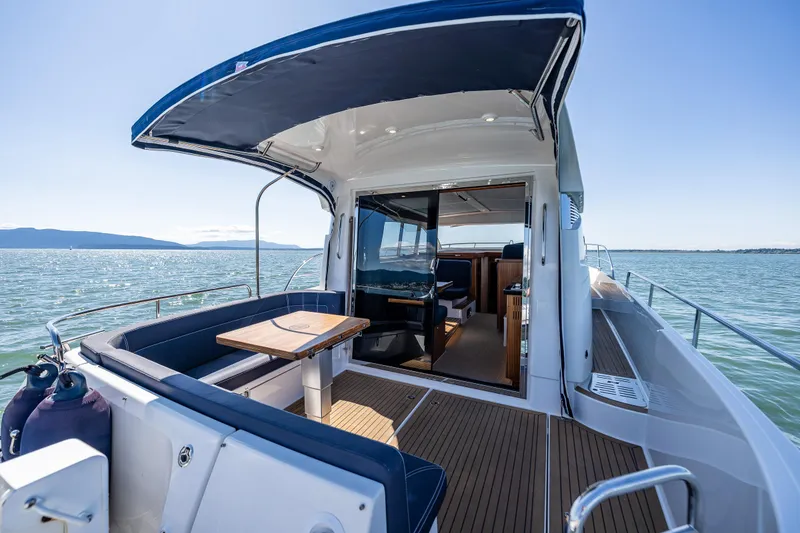 Slide: The Image of Nimbus 405 Coupé #88, 2021 model, luxury yacht interior with open deck and scenic ocean view. - 8