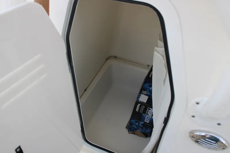 Slide: The Image of Storage compartment inside 2025 Pioneer 220 Bay Sport boat, featuring spacious interior. - 14